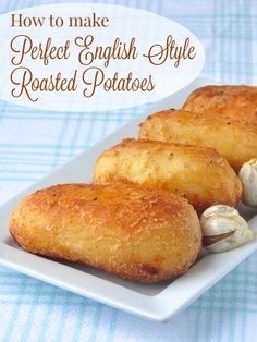 three english style rolls on a plate with garlic in the middle and text overlay that reads how to make perfect english style roasted potatoes