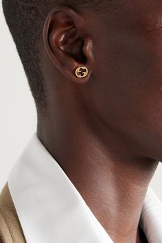 Gucci's earrings have been made in Italy from polished 18-karat gold that's cast in the shape of the signature interlocking 'GG' logo - the insignia honors the legacy of the label's late founder and has been a hallmark of the brand for nearly a century. The small size makes them perfect for everyday wear. Gg Logo, Net A Porter, Jewellery And Watches, Ear Piercings, Hallmark, Luxury Design, Gold Earrings, Porter, Everyday Wear