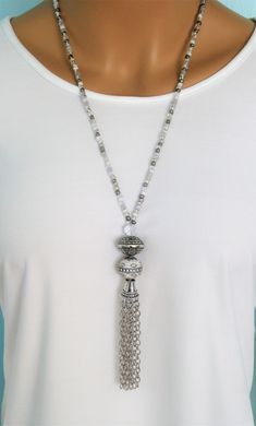 "Four different styles of silver beaded tassel necklaces to choose from, designed and handmade by Ralston Originals. I made all the tassels with silver chains, and covered each in a beautiful antique silver metal bead cap. The first beaded necklace (Pictures 1-3), is made with a very unique and beautiful large silver bead, with many tiny crystal inlaid accents. The necklace is also made with a large antique silver crystal roundel, and a large clear crystal bead. The beaded chain on the necklace Luxury Single Strand Beaded Necklaces As Gift, Luxury Long Single Strand Beaded Necklace, Luxury Traditional Sterling Silver Beaded Necklace, Cheap Long Beaded Necklace With Round Beads, Damas Jewellery, Faux Collar, Collar Necklaces, Beaded Jewelry Necklaces, Beaded Tassel Necklace