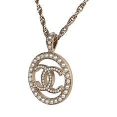 This Chanel round CC pearl pendant necklace with light gold tone hardware and pearls, features a long adjustable rope chainlink necklace with a round pendant with the signature CC in the center beaded with faux pearls and has a lobster clasp closure.Origin: FranceCondition: New and never wornAccompanied by: Chanel box, ribbon, retail UPCMeasurements: Chain Drop(not including pendant: 11.75"; Pendant: 1.25" x 1.25" | Chain Length: 24.5" Metal Pendant Necklace, Chanel Box, Box Ribbon, Madison Avenue, New Metal, Pearl Pendant Necklace, Cc Logo, Metal Pendant, Round Pendant