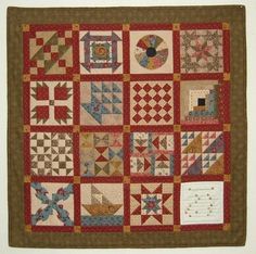 a quilt with many different designs on it