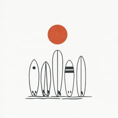 three surfboards are lined up in front of an orange sun on a white background