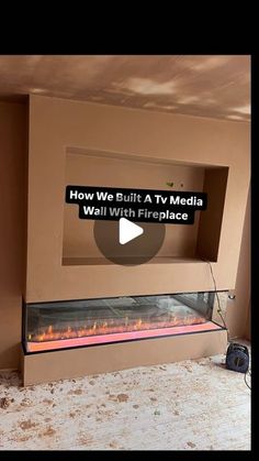 a fireplace with the words how we built a tv media wall with fireplace inserts