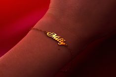 This personalized name bracelet, made of 14k gold, is a perfect dainty gift for mom. Ideal as a personalized jewelry birthday gift, this elegant name bracelet adds a touch of sophistication to any occasion. 𝐃𝐄𝐓𝐀𝐈𝐋𝐒 💎 1 name bracelet, included 💎 Material: 14k Solid Gold  💎 Length: Small, Medium or Large 💎 Finish: Polished 𝐇𝐎𝐖 𝐓𝐎 𝐎𝐑𝐃𝐄𝐑 1. In the "Personalization Field", enter the name to be engraved 2. Select the bracelet length 4. Select desired shipping method  𝐘𝐎𝐔 𝐌𝐈𝐆𝐇𝐓 𝐀𝐋𝐒𝐎 𝐋𝐈𝐊𝐄 💎 https://www.etsy.com/shop/RUMJewelry?section_id=47032677 💎 https://www.etsy.com/listing/755198568/evil-eye-ring-gold-evil-eye-ring-with?click_key=7f668b2e02e1e4fc060be1fd5285cbac38f836bb%3A755198568&click_sum=463ed137&ref=shop_home_active_42&pro=1&frs=1 𝐒𝐇𝐈𝐏𝐏𝐈𝐍𝐆 Sh Classic 14k Gold Custom Name Bracelet, 14k Gold Nameplate Bracelet For Anniversary, Custom Name 14k Yellow Gold Bracelet, 14k Gold Name Bracelet For Anniversary, Elegant 14k Gold Name Bracelet For Mother's Day, Personalized Yellow Gold Nameplate Bracelet, 14k Gold Adjustable Name Bracelet For Personalized Gift, Classic Gold Name Bracelet For Anniversary, Dainty Name Bracelet For Anniversary