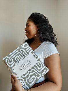 a woman holding a book in her hands