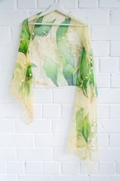 Hand painted luxury silk chiffon scarf with Lilies of The Valley. It is painted in warm Green and gold amber tones background. Painting was inspired by sunny May nature so reflects the details of like a live little white blossoms and smooth green leaves. This design Scarf is MADE TO ORDER and available in 2 SQUARE and 5 OBLONG sizes (with butterflies or without): 21*x21 inches (55x55cm)- Very small square. Can serve as a kerchief; wrist, head or bag band. 35*35 inches (90*90cm) -Possible various Gold Silk Scarf For Spring, Elegant Yellow Dupatta For Summer, Elegant Yellow Dupatta For Spring, Spring Yellow Silk Dupatta, Summer Wedding Shawl-style Dupatta, Summer Wedding Shawl Dupatta, Wedding Summer Shawl Dupatta, Summer Wedding Silk Dupatta, Silk Dupatta For Summer Wedding