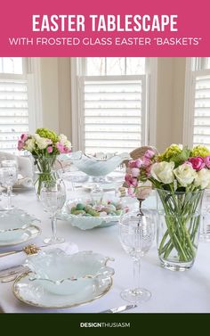 an easter table setting with flowers in glass vases and plates on the dining room table