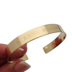 This gold cuff bracelet features custom engraved roman numeral date, perfect for a special occasion or to commemorate a special memory. Handcrafted with care, this beautiful bracelet is the perfect gift for a special woman. A contemporary 14K Gold filled bracelet for women.  This gorgeous, sparkling bracelet will certainly make a statement!  Unique, personal gift for her to any occasion! It is crafted from quality gold filled and polished for shiny finish and sophisticated look.  This is a gift that can be engraved with any symbols you want.  I can engrave a roman numeral date as well as any names or words. Any sentence up to 10 words (50 characters) can be engraved.  This is a stylish choice for dresses, suits and casual wear.  With your message, this will make a wonderful personal birthd Personalized Gold Bracelet, Date Bracelet, Engraved Bangle, Engraved Cuff, Sparkle Bracelet, Gold Armband, Wife Birthday, Gold Engraving, Gold Bracelet Cuff