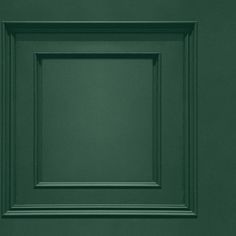 an image of a green painted wall with square frame on the front and bottom panel