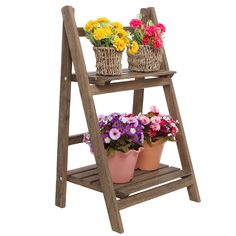 two flower pots on a wooden stand with flowers