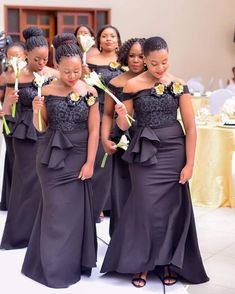 the bridesmaids are all dressed in black