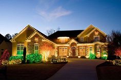 a large house with christmas lights on it