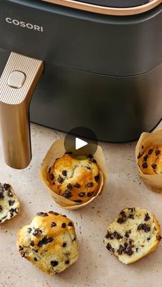 mini chocolate chip muffins sitting next to an electric toaster