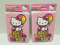 two pink hello kitty party boxes on display