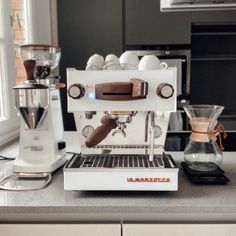 an espresso machine sitting on top of a counter