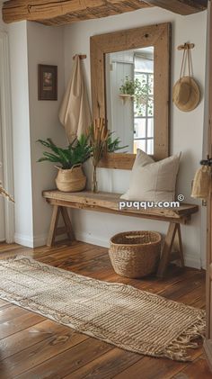 a wooden bench sitting under a mirror in a living room next to a rug and potted plant