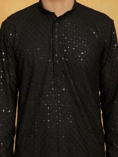 VASTRAMAY Men's Black Cotton Blend Kurta Upgrade your ethnic wear collection with this stylish black kurta from VASTRAMAY. Made from cotton blend, this kurta is perfect for both casual and festive occasions. It features a mandarin collar, full button placket, and long sleeves, offering a blend of traditional and contemporary style. Features: Color: Black Fabric: Cotton Blend Design: Solid Sleeve Length: Long Sleeves Collar: Mandarin Collar Specifications: Brand: VASTRAMAY Fit: Regular Fit Occasion: Festive/Casual Wash Care: Hand Wash/Machine Wash Material & Care: 100% cotton. Hand-wash cold, wash dark colors separately, do not bleach, dry in shade, inside out, medium iron. Legal Disclaimer: The product is guaranteed to be 100% genuine. Product images are for illustrative purposes only. Ima Traditional Black Bandhgala With Chikankari Embroidery, Designer Black Cotton Sherwani, Black Straight Kurta Bandhgala For Festive Season, Festive Black Straight Kurta Bandhgala, Black Sherwani With Mirror Work, Traditional Black Cotton Bandhgala, Black Bandhgala With Cutdana For Festive Occasions, Traditional Black Straight Kurta Sherwani, Black Bandhgala With Chikankari Embroidery Bollywood Style