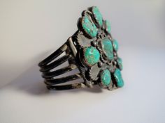 This is truly vintage turquoise. I am pretty sure it was made in the late 40's or very early 50's. It is stamped Sterling, including the initial stamp W. Vintage Patina Cuff Bracelet, Vintage Turquoise Stamped Cuff Bracelet, Vintage Turquoise Stamped Bracelets, Vintage Green Bracelet With Patina, Green Vintage Cuff Bracelet, Handmade Turquoise Vintage Cuff Bracelet, Vintage Stamped Turquoise Jewelry, Vintage Turquoise Stamped Jewelry, Vintage Blue Cuff Bracelet