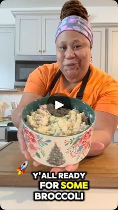 a woman is holding a bowl of food in her hands and making a funny face with the words y'all ready for some broccoli