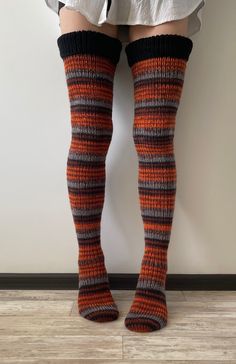 Thigh high socks Chunky socks Cozy long socks Hand knit socks Over knee socks Wool socks are chunky, warm, and cozy. Knitted socks can be a gift for a loved one, for friends, or loved ones! These handmade socks are sized to fit an adult woman or teenager. Model has a leg volume in the thickest place 48 cm (18.9 inches) To avoid slipping, use elastic bands or suspenders (not included) Orange striped socks length - 74 cm (29 inches) Green striped socks length - 80 cm (31.5 inches) Content handmade Long Knitted Socks, Knit Thigh High Socks, Chunky Socks, Striped Knee High Socks, Tall Socks, Over Knee Socks, Handmade Socks, Hand Knit Socks, Knitted Socks