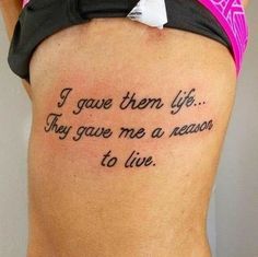 a woman with a tattoo on her back saying i gave them life they gave me a reason to live