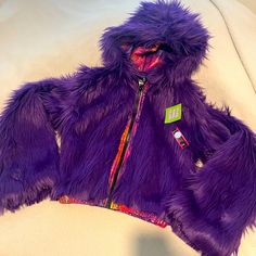 Deep Purple Cropped Faux Fur Rave Hoodie. New With Tags. It’s Technically Not Reversible Because The Zipper Is Only One Way But The Seams Are Completely Closed So It Honestly Could Be Worn Either Way. I’m 5’9 With Pretty Long Arms And The Length Is Perfect For Me Zip Up Hoodie With Fur Inside, Fuzzy Purple Jacket, Rave Hoodie, Rave Fur Coat, Winter Purple Faux Fur Outerwear, Purple Faux Fur Coat, Perfect For Me, Colorful Hoodies, Deep Purple