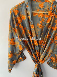 Beautiful handmade, Vintage / Boho-style Indian Silk kimono, with bright colourful, Indian prints. This gown is luxury Indian Silk, a beautiful soft, elegant and sensual fabric, which drapes beautifully over the body. This robe is full length, with belt. These Gowns are free Size, fits UK 8 to 14 Machine washable on cool Kimono, inspired handmade, vintage / Boho style dressing gown, kimono robe. This robe is part of our luxurious collection, they make a beautiful gift for the ones you love, and Printed Orange Beach Sets, Summer Orange Floral Print Sets, Multicolor Floral Print Robe For Vacation, Multicolor Spring Wedding Kimono, Silk Kimono Robe, Silk Gifts, Vintage Boho Fashion, Indian Prints, Cotton Kimono