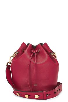 Find FENDI Mon Tresor Bucket Bag on Editorialist. This Fendi Mon Tresor Bucket Bag is crafted from calfskin with a suede lining. It features a top drawstring closure, one main compartment, and one interior slip pocket. The bag includes a detachable shoulder strap and an original material card. It measures approximately 6.5 inches in width, 9 inches in height, and 6 inches in depth. The shoulder strap has a 14-inch drop. The bag is in good condition with some wear throughout. There is light rubbi Designer Red Bucket Bag For Formal Occasions, Elegant Red Bucket Bag For Formal Occasions, Modern Red Bucket Bag For Formal Occasions, Red Leather Shoulder Bag For Everyday Luxury, Elegant Red Bucket Bag, Luxury Red Bucket Bag With Detachable Strap, Red Luxury Bucket Bag, Luxury Red Pouch Bucket Bag, Fendi Bucket Bag