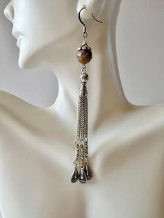 "Round Stone with detailed bead cap + Tibetan decadent bead and chain combination dangling below. Total dangle length is 4 1/2\". There are various colorways and charms. See options to select which one."