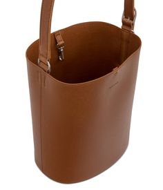 Bucket hobo with a self-bonded interior finish, adjustable strap and logo hardware detail on the right side body, tab with dog clip closure at top and a removable interior pouch with nylon zip closure. Dimensions: 9.5”L x 11.5”H x 7.25”D Handle Drop: 10.5”-15” Interior Pouch: 8”L x 5.75”H x 0.75” All of the interior li Everyday Bucket Hobo Bag With Detachable Strap, Everyday Use Hobo Bag With Detachable Strap, Bucket Shoulder Bag With Snap Closure, Business Bucket Satchel With Adjustable Strap, Classic Hobo Bag With Snap Closure For Everyday, Daily Use Bucket Bag With Snap Closure, Modern Brown Bag With Snap Closure, On-the-go Crossbody Hobo Bag With Snap Closure, Everyday Bucket Satchel With Snap Closure