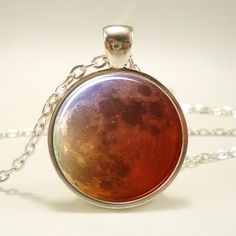 This listing is for a handmade art pendant featuring a photograph of the full moon. For more moon pendants click the link below: http://www.etsy.com/shop/rainnua/search?search_query=moon&search_submit=&search_type=user_shop_ttt_id_6763570&shopname=rainnua&view_type=gallery When you purchase this listing you will receive 1 silver plated pendant, and 1 matching chain. Pendant size is 1" inch, chain length is 24" inches long. Chains can be cut shorter at your request. Art print is sealed under a sm Nebula Necklace, Hipster Jewelry, Moon Galaxy, Galaxy Jewelry, Galaxy Pendant, Jewellery Inspiration, Red Moon, Art Pendant, Harvest Moon