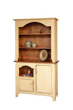 an old fashioned wooden hutch with cupboards