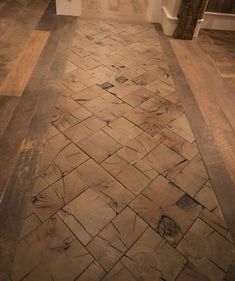 an empty hallway with wood flooring and white walls