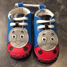 Thomas The Train Baby Shoes Blue Non-slip Round Toe Booties, Blue Non-slip Booties For Playtime, Casual Blue Booties For Playtime, Red Sneakers With Soft Sole For Playtime, Non-slip Round Toe Sneakers For Play, Non-slip Low-top Booties For Playtime, Playful Closed Toe Booties For Playtime, Casual Blue Booties With Soft Sole, Cute Low-top Booties For Playtime