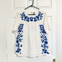 New With Tags Made In Italy White Embroidered Short Sleeve Top With Relaxed Fit, White Embroidered Top With Short Sleeve, White Embroidered Top With Short Sleeves, Relaxed Fit, White Embroidered Relaxed Fit Top, Blue Tops With Geometric Embroidery For Spring, Casual Short Sleeve Embroidered Top With Tonal Embroidery, Casual Short Sleeve Embroidered Top With Tonal Details, Casual Blue Embroidered Top With Floral Details, Casual Blue Top With Geometric Embroidery