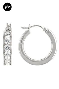 Bella Luce�� white diamond simulant 3.25ctw round rhodium over sterling silver hoop earrings. Measure approximately 0.81"L x 0.19"W with saddleback backings. The Diamond equivalent weight is 1.96ctw. Classic Silver Channel Set Huggie Earrings, Classic Silver Huggie Earrings With Diamond Accents, Classic Silver Huggie Earrings Channel Set, Classic Sterling Silver Hoop Earrings With Diamond Accents, Classic Silver Hoop Diamond Earrings, Classic Silver Hoop Earrings With Prong Setting, Classic Diamond Hoop Earrings Hypoallergenic, Classic Small Hoop Jewelry With Channel Set, Classic Diamond Hypoallergenic Hoop Earrings