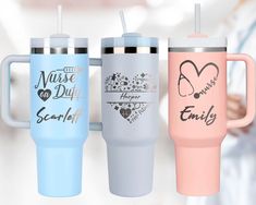 three different colored travel mugs with the words nurse, happy and smiley on them