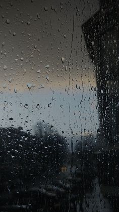 rain drops on the window as it is raining