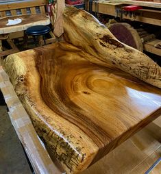 a wooden bench made out of wood in a shop