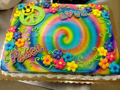 a cake decorated with flowers and the words peace on it