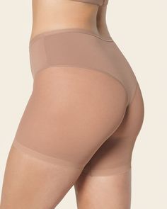 Shape your curves and prevent chafing at the same time! This slip short is made of a super soft and comfy compression fabric to smooth out your tummy and shape your waist. It has a sheer short bottom for an invisible look under clothes, plus this design helps reduce chafing under skirts and dresses. The thong effect in the back offers a light butt-lifting effect. Go ahead and wear this slip short under fitted clothes – it won't show through! Compressive Smoothing Mid-thigh Shapewear, Smoothing Compressive Mid-thigh Shapewear, Compressive Shapewear With Smoothing, Short Length, Fitted Smoothing Tights Short Length, Compressive Smoothing Shapewear Shorts, Compressive Bottoms With Built-in Bra Mid-thigh Length, Compressive Smoothing Shapewear In Short, Short Compressive Shapewear For Smoothing, Fitted Smoothing Short Length Tights