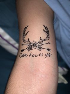 a tattoo that says dad loves ya with antlers and flowers