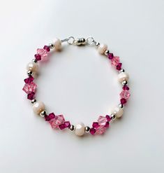 Swarovski crystals are well known for the brilliant colors that catch light from all directions. This bracelet is made of brilliant 6mm rose pink and 4mm dark fushia bicone crystals with accent beads.   All items are handmade in the USA with care and attention to detail. Free shipping to anywhere in the US with purchase of $35 or more. Pink Crystal Beaded Round Bracelets, Elegant Pink Hypoallergenic Beaded Bracelets, Elegant Pink Hypoallergenic Bracelet, Pink Crystal Bracelets With Round Beads, Elegant Pink Faceted Crystal Bracelet, Pink Crystal Bracelets With Faceted Beads, Pink Hypoallergenic Bracelets For Wedding, Pink Faceted Crystal Bracelet Gift, Pink Faceted Crystal Bracelet For Gift