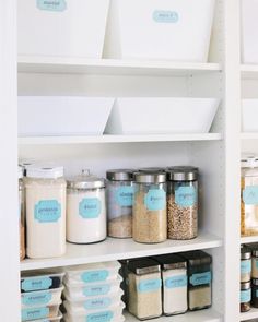 the pantry shelves are filled with different types of food and containers for storing items such as rice, cereal or other things