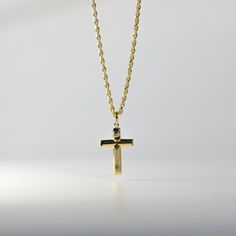 Proclaim your love and believe in Christianity in the most sophisticated way. Highlight the power of your faith in Jesus Christ and His sacrifice through this 14K solid gold cross pendant. The minimalist cross pendant exquisitely represents the long-standing Christian faith through its elegant finish. Finely cut edges showcase utmost precision, giving the cross pendant a neat appeal that is captivating to the eyes. 100% tarnish-free, this solid gold pendant will shine as radiant as your faith in 14k Gold Spiritual Cross Pendant Necklace, Spiritual 14k Gold Cross Pendant Necklace, 14k Gold Cross Necklace With Adjustable Chain, 14k Gold Cross Necklace For Spiritual Wear, 14k Gold Tarnish Resistant Pendant Cross Necklace, 14k Gold Tarnish-resistant Cross Pendant Necklace, 14k Gold Pendant Cross Necklace, Minimalist Yellow Gold Cross Pendant Necklace, Tarnish-resistant Yellow Gold Cross Pendant Necklace