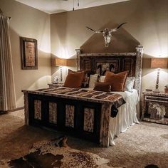 a large bed in a bedroom next to two lamps