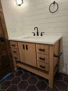 a bathroom sink with two faucets on it