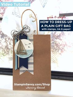 a paper bag with a sailboat on it and the words how to dress - up a plain gift bag with stamps, ink & paper