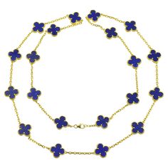 VCA Lapis Lazuli Vintage Alhambra Necklace in 18k yellow gold. The necklace features 20 lapis lazuli clover motifs. Equipped with lobster clasp. Inscribed: VCA 750, 4K629.132. Stamped with french hallmarks and makers marks. Motif measurements: 15mm. Accompanied by VCA valuation report and necklace pouch Length: 33 inches. . Luxury Royal Blue Jewelry, Luxury Gold Necklace With Lapis Lazuli, Vintage Alhambra Necklace, Alhambra Necklace, Necklace Pouch, Van Cleef Arpels, Van Cleef, Makers Mark, Lapis Lazuli