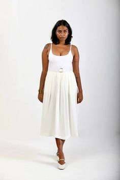 This skirt is a holiday essential. For days when you want something comfortable with style, you will find yourself reaching out for this mid-length A-line skirt to pair with nearly anything and everything. It is high waisted, has a concealed back zipper and gentle pleats all over that emanate from the waistband. The soft double georgette allows for breezy and elegant movements with every step. The model is wearing size S. 🌸 〰️〰️〰️ 🌸 〰️〰️〰️ 🌸 Care and Composition 100% Viscose Double GeorgetteD Flowy Lined Maxi Skirt For Brunch, Chic Flowy Lined Skirt, Chic Gathered Maxi Skirt For Day Out, Flowy Long Pleated Skirt For Day Out, High Waist Flowy Skirt With Wide Waistband, Brunch Midi Length Gathered Maxi Skirt, Chic Full Maxi Skirt For Day Out, Flattering Midi Skirt For Summer, Summer Daywear Pleated Skirt With Lining